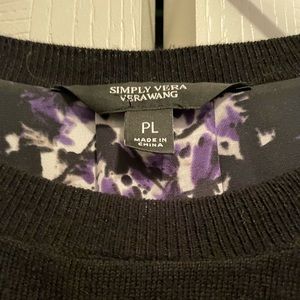 This is a light, dressy black sweater with a lining that is purple and floral